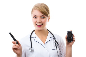 Happy woman doctor holding glucometer, measuring and checking sugar level, concept of diabetes