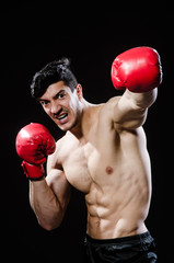 Fototapeta na wymiar Muscular man in boxing concept
