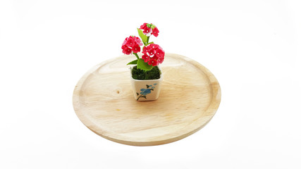 Small Polymer Clay Of Flowers on wooden plate; white background