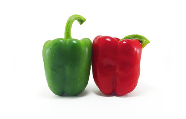 Red and green bell pepper on white background