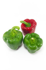 Red and green bell pepper on white background