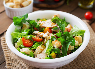Fresh salad with chicken breast, arugula, lettuce and tomato.