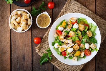 Salad with chicken, mozzarella and cherry tomatoes. Top view