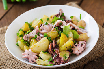 Potato salad with pickled octopus and green onions