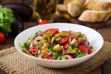 Salad baked eggplant and fresh tomatoes