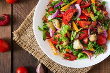 Salad baked eggplant and fresh tomatoes. Top view