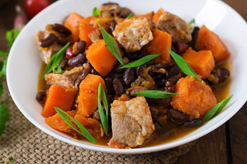 Baked spicy pumpkin with meat and beans