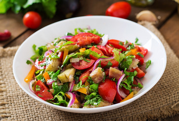 Salad baked eggplant and fresh tomatoes