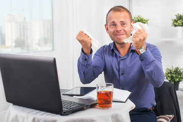 Young businessman working in the office, very concerned, a panic