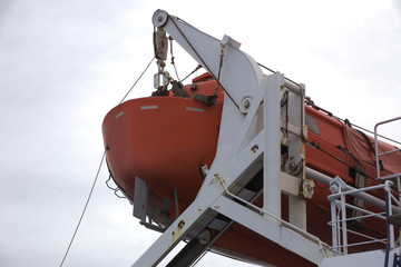 A Lifeboat hanging aboard a bigger ship