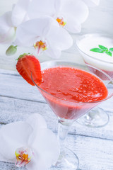 Fresh fruit and berry cocktail  on shabby wooden boards