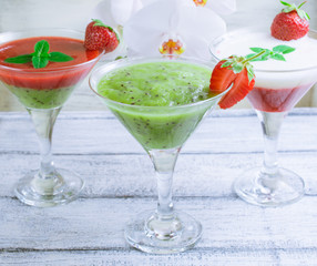 Fresh fruit and berry cocktail  on shabby wooden boards