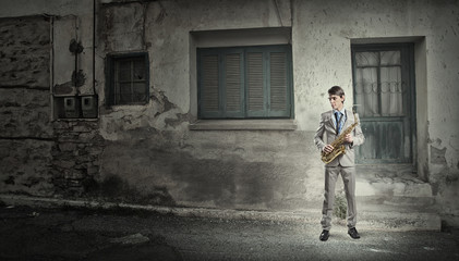 Obraz na płótnie Canvas Handsome saxophonist. Concept image