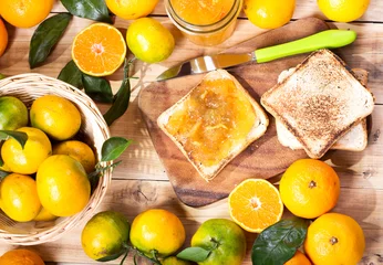 Foto auf Glas toast with orange mandarin marmalade with fresh fruits © Nitr