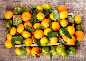 fresh mandarin oranges fruit  in wooden box