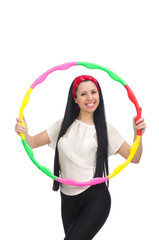 A girl in sport suit with hula hoop isolated on white © Elnur