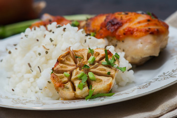 roasted chicken drumstick garnished with rice