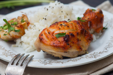 roasted chicken drumstick garnished with rice