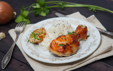 roasted chicken drumstick garnished with rice