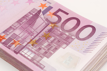 Money - Isolated stack of Five hundred (500) euro bills banknotes with white background