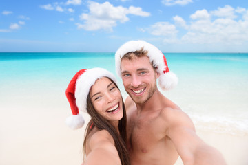 Christmas couple selfie picture on beach vacation