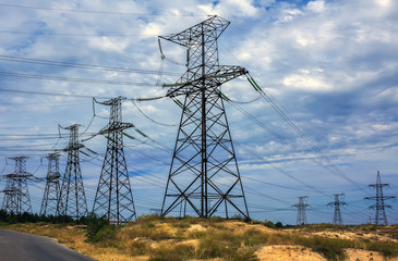 High-voltage power lines on a background of storm clouds