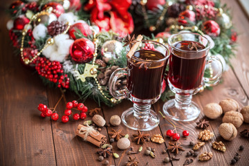 Christmas hot mulled wine with spices on a wooden table. The idea for creating greeting cards