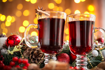 Christmas hot mulled wine with spices on a wooden table. The idea for creating greeting cards