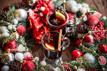 Christmas hot mulled wine with spices on a wooden table. The idea for creating greeting cards