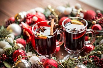 Christmas hot mulled wine with spices on a wooden table. The idea for creating greeting cards