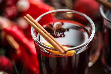 Christmas hot mulled wine with spices on a wooden table. The idea for creating greeting cards