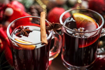 Christmas hot mulled wine with spices on a wooden table. The idea for creating greeting cards