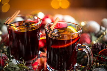 Christmas hot mulled wine with spices on a wooden table. The idea for creating greeting cards