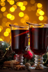 Christmas hot mulled wine with spices on a wooden table. The idea for creating greeting cards