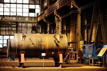 Fototapeta na wymiar Industrial tank inside old factory