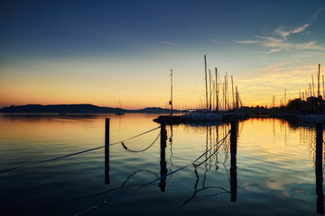 Boats on dock sunset