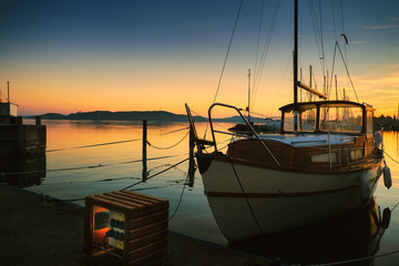 Boats on dock sunset