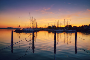 Fototapeta na wymiar Boats on dock sunset