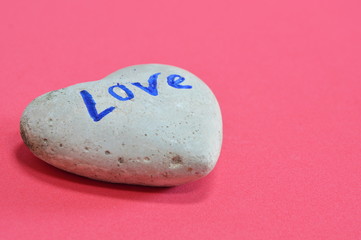 heart rock on red background