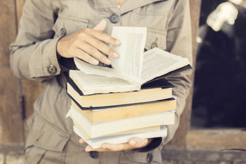 Girl reading a books outdoors