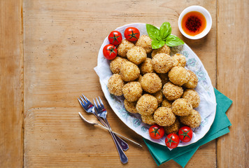 healthy italian appetizer with risotto balls arancini , green ol
