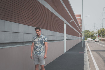 Young handsome man posing in the street