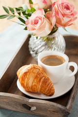Romantic breakfast with coffee and croissant