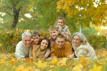 Fototapeta premium Family relaxing in autumn park