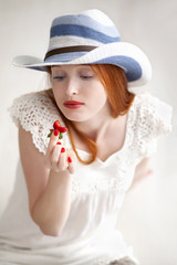 Attractive beautiful long haired woman holding a glass fruit cup