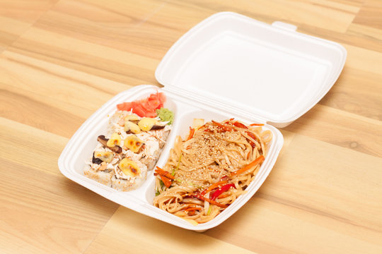 Chinese noodles and Japanese rolls in box