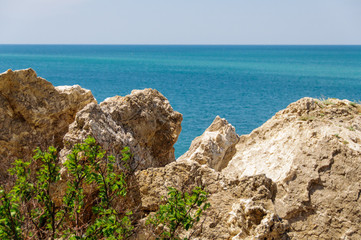 View from the rock on very blue sea at a clear weather