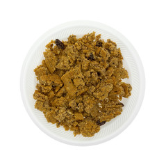 Crumbled oatmeal raisin cookies on a white plate