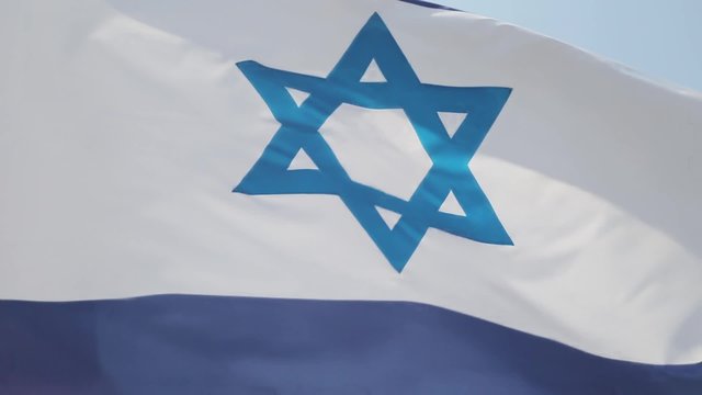 Israel flag on blue sky background