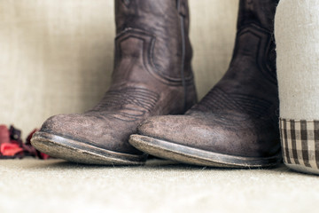 toes of brown cowboy boots with vintage look